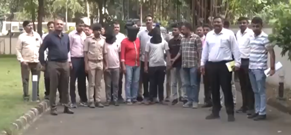 Gujarat Railway Workers Arrested and police taking them with mask on